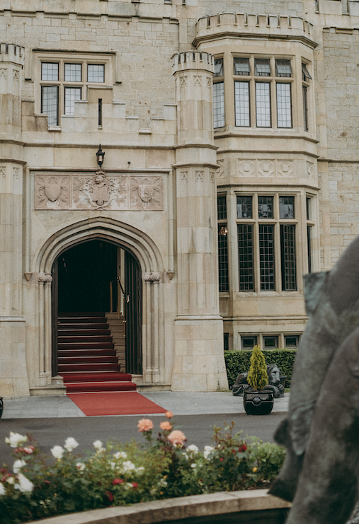 Entrance of Lough Eske Castle in Donegal, Ireland, with red carpet on the steps and historic stone façade prepared for a luxury castle wedding.