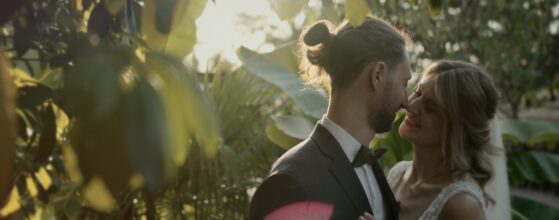 Marie and Lukas walking through the vineyards at Winzerhotel Kolleritsch in Styria, cinematic wedding film by an Austria wedding videographer.