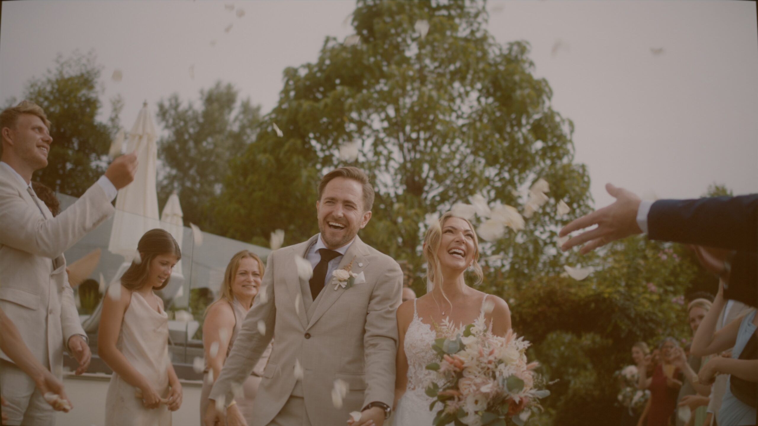 Rahel and William wedding portrait at La Villa Hotel in Piedmont, Italy, with vineyards in the background.