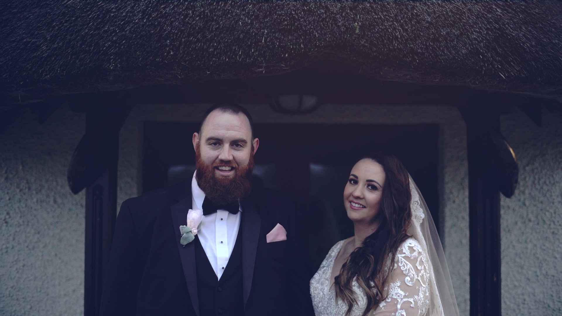 Shauna and Kevin holding each other at sunset on Lusty Beg Island, with the Fermanagh lakes in the background – an intimate moment from their wedding film.